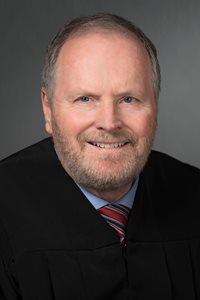 Senior Judge Michael L. Kirk
