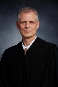 Senior Judge Bruce A. Peterson