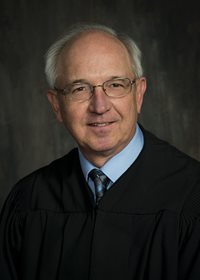 Senior Judge Matthew J. Opat
